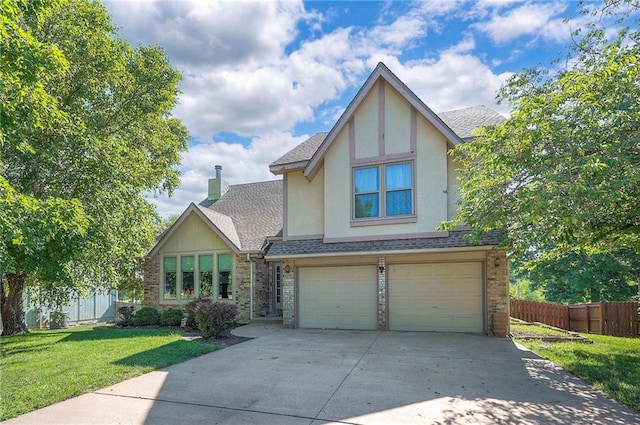 3945 N 123rd Ter, Kansas City, KS 66109 - tudor-style house with driveway, a shingled roof, a garage, stucco siding, and brick siding