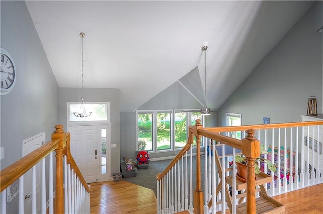 3945 N 123rd Ter, Kansas City, KS 66109 - entrance foyer featuring high vaulted ceiling, wood finished floors, and a chandelier