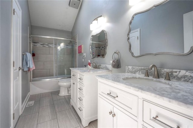 3945 N 123rd Ter, Kansas City, KS 66109 - full bathroom featuring two vanities and shower / bath combination with glass door