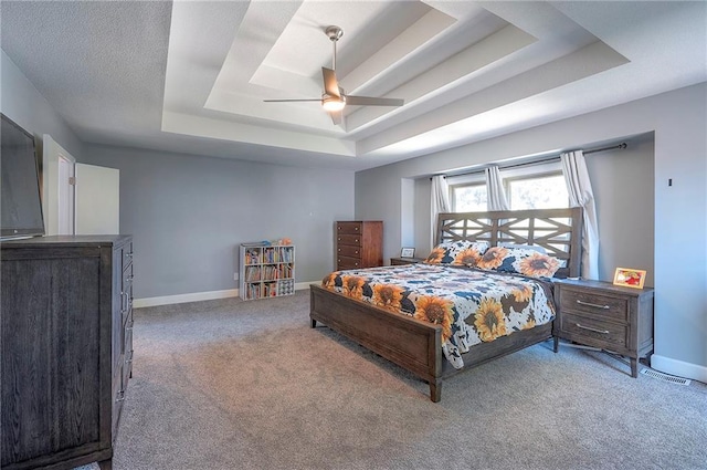 3945 N 123rd Ter, Kansas City, KS 66109 - carpeted bedroom featuring a raised ceiling and ceiling fan