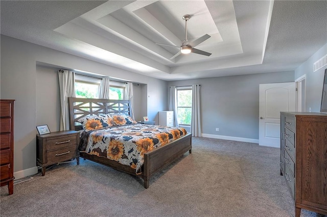 3945 N 123rd Ter, Kansas City, KS 66109 - carpeted bedroom featuring a raised ceiling and ceiling fan