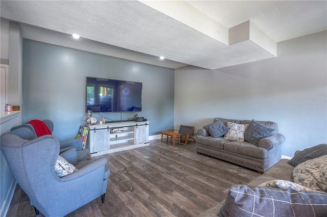 3945 N 123rd Ter, Kansas City, KS 66109 - living room with dark wood-style flooring and a textured ceiling