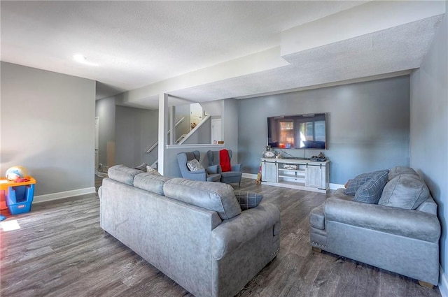 3945 N 123rd Ter, Kansas City, KS 66109 - living area with wood finished floors, stairway, and a textured ceiling