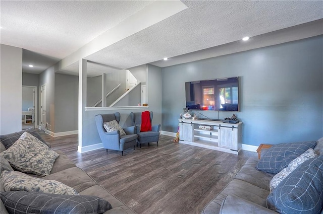 3945 N 123rd Ter, Kansas City, KS 66109 - living room featuring wood finished floors, a textured ceiling, stairway, and recessed lighting