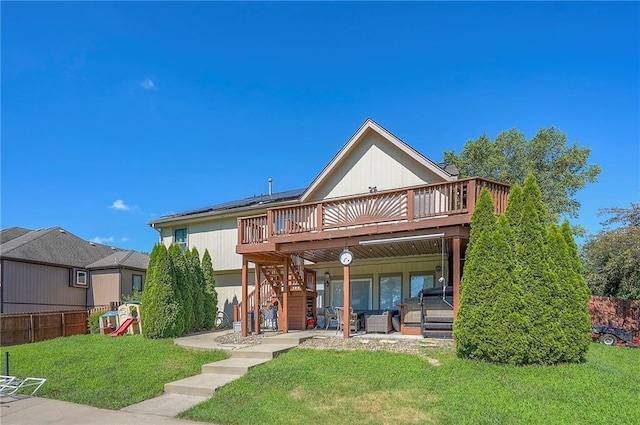 3945 N 123rd Ter, Kansas City, KS 66109 - rear view of property featuring a wooden deck, stairs, and a patio area