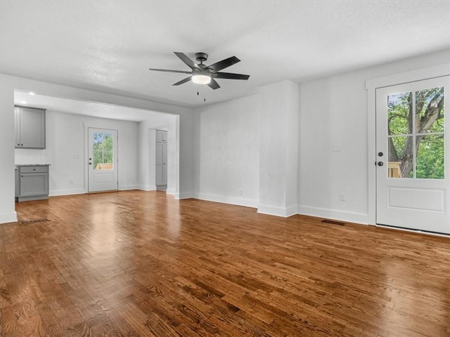 2832 Rushmore Ln, Saint Joseph, MO 64505 - unfurnished living room featuring wood finished floors and ceiling fan