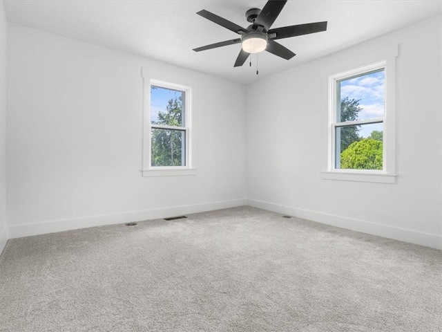2832 Rushmore Ln, Saint Joseph, MO 64505 - carpeted spare room with baseboards and a ceiling fan