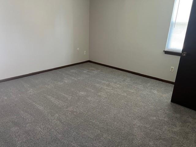 10195 Haskins St, Lenexa, KS 66217 - carpeted spare room with baseboards