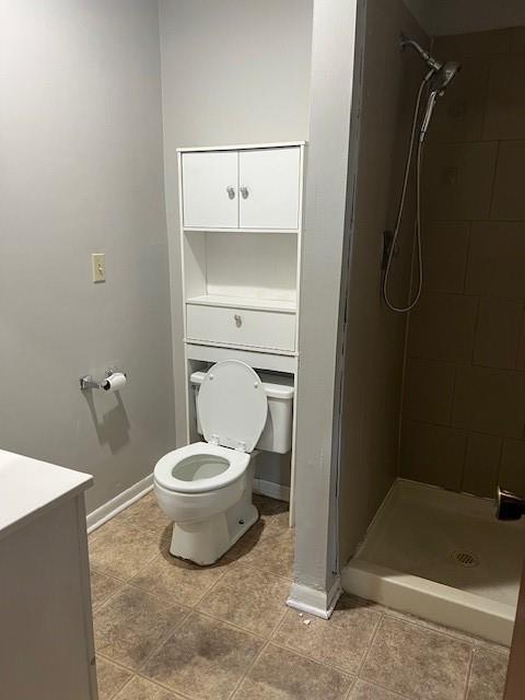 10195 Haskins St, Lenexa, KS 66217 - bathroom with a stall shower, vanity, and tile patterned flooring