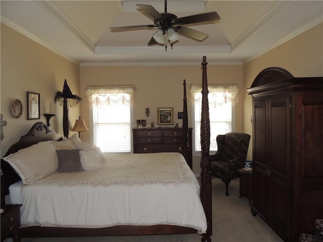3722 S Bolger Ct, Independence, MO 64055 - bedroom featuring a raised ceiling, light colored carpet, multiple windows, ornamental molding, and a ceiling fan