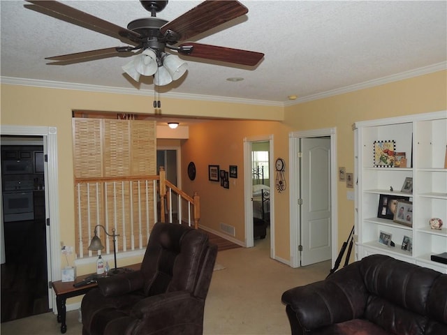 3722 S Bolger Ct, Independence, MO 64055 - living area featuring carpet floors, crown molding, a ceiling fan, a textured ceiling, and stairway