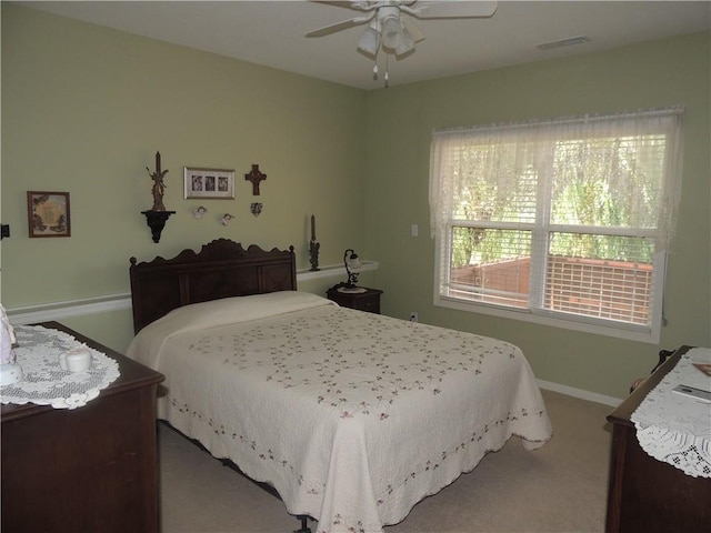 3722 S Bolger Ct, Independence, MO 64055 - carpeted bedroom with baseboards and a ceiling fan