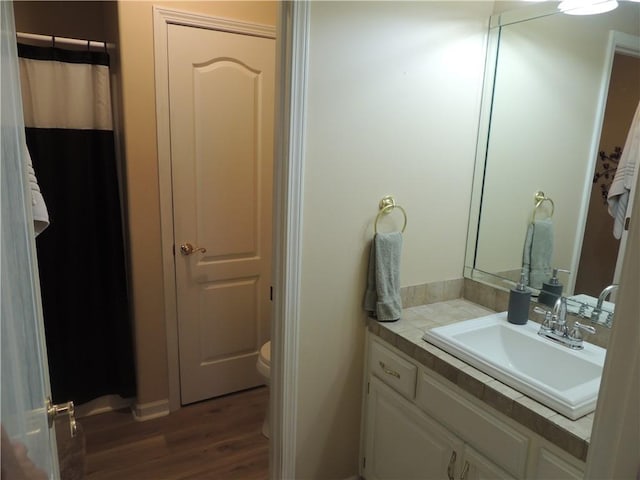 3722 S Bolger Ct, Independence, MO 64055 - full bath featuring wood finished floors and vanity