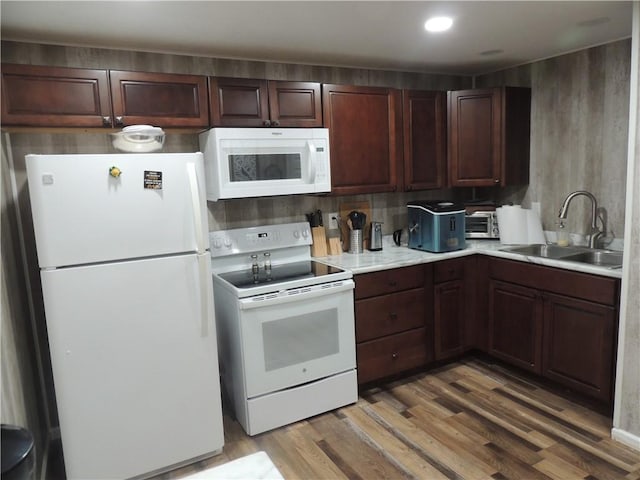 3722 S Bolger Ct, Independence, MO 64055 - kitchen featuring white appliances, light wood-style flooring, and light countertops
