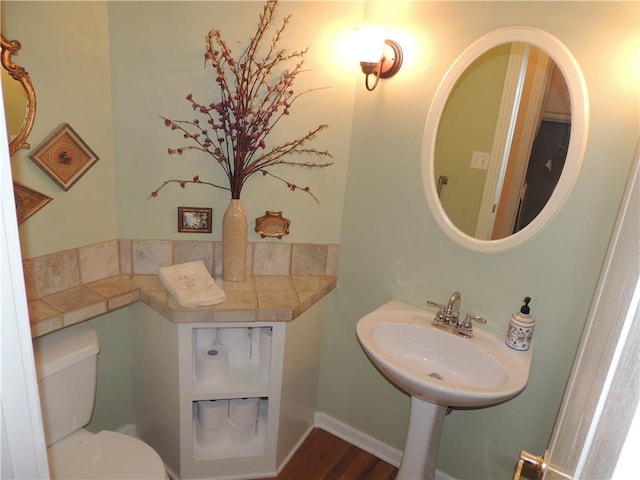 3722 S Bolger Ct, Independence, MO 64055 - half bathroom with toilet and wood finished floors