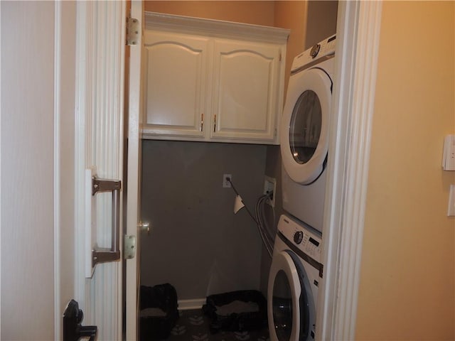 3722 S Bolger Ct, Independence, MO 64055 - washroom featuring estacked washer and dryer and cabinet space