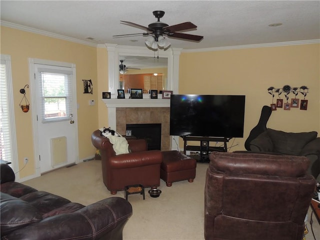 3722 S Bolger Ct, Independence, MO 64055 - carpeted living area featuring crown molding, ceiling fan, and a tile fireplace