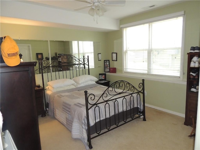 3722 S Bolger Ct, Independence, MO 64055 - carpeted bedroom featuring baseboards and a ceiling fan