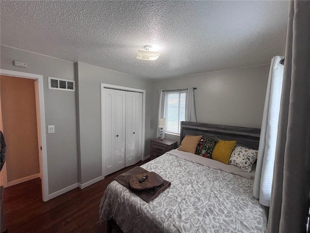 3335 N 54th St, Kansas City, KS 66104 - bedroom with wood finished floors, a closet, and a textured ceiling