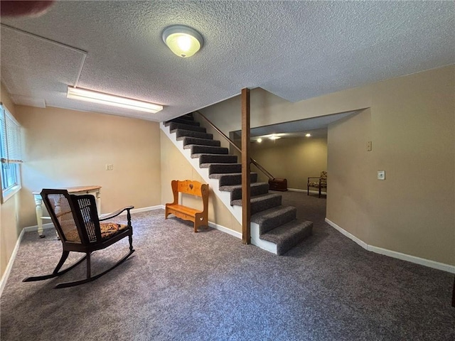 2425 Elephant Trl, Saint Joseph, MO 64506 - below grade area featuring stairs, a textured ceiling, and carpet flooring