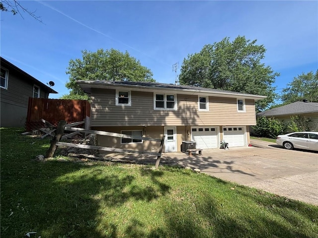 2425 Elephant Trl, Saint Joseph, MO 64506 - rear view of property featuring driveway and a garage