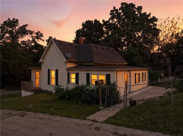 216 Dunbar Ave, Excelsior Springs, MO 64024 - view of front of home featuring a chimney