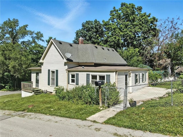 216 Dunbar Ave, Excelsior Springs, MO 64024 - view of front of house featuring a chimney and a shingled roof