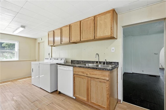 216 Dunbar Ave, Excelsior Springs, MO 64024 - kitchen with white dishwasher, washing machine and clothes dryer, and light wood-type flooring