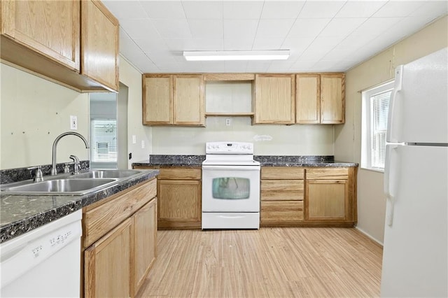 216 Dunbar Ave, Excelsior Springs, MO 64024 - kitchen featuring white appliances, light wood-type flooring, dark countertops, and light brown cabinets