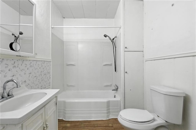 216 Dunbar Ave, Excelsior Springs, MO 64024 - full bath featuring wood finished floors, shower / washtub combination, and vanity