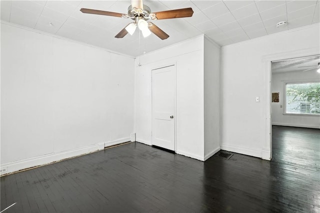 216 Dunbar Ave, Excelsior Springs, MO 64024 - unfurnished room featuring ceiling fan, a smoke detector, dark wood-style floors, and ornamental molding