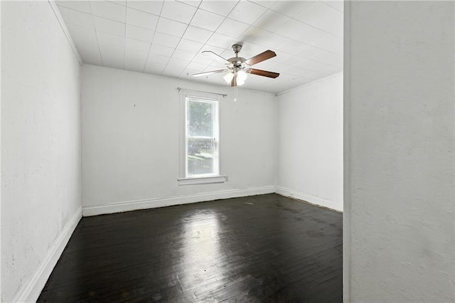 216 Dunbar Ave, Excelsior Springs, MO 64024 - spare room with ceiling fan, dark wood-style flooring, and a textured wall