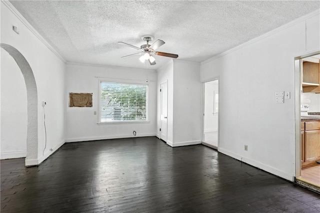 216 Dunbar Ave, Excelsior Springs, MO 64024 - spare room with ceiling fan, ornamental molding, arched walkways, dark wood-type flooring, and a textured ceiling