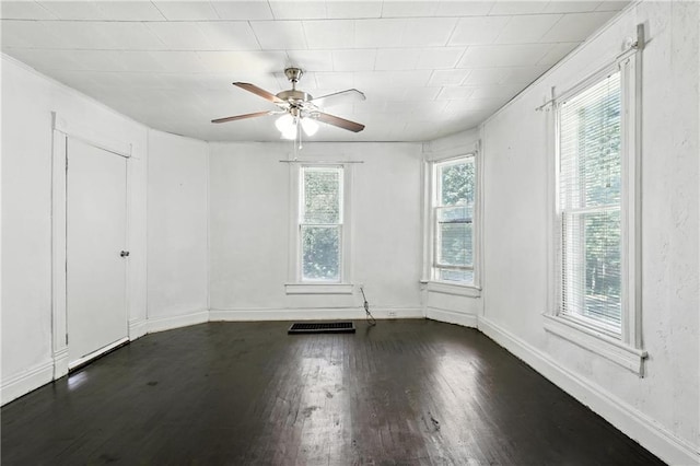 216 Dunbar Ave, Excelsior Springs, MO 64024 - spare room with dark wood finished floors and ceiling fan