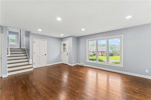 9916 Floyd St, Overland Park, KS 66212 - foyer with recessed lighting, wood finished floors, and stairway