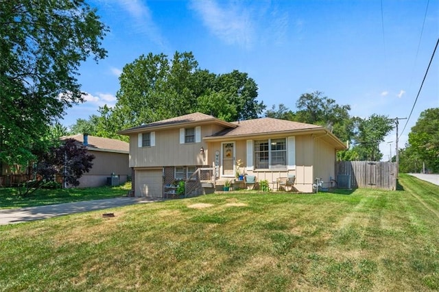 800 S Park Ave, Oak Grove, MO 64075 - tri-level home featuring a garage and driveway