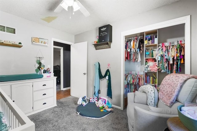 800 S Park Ave, Oak Grove, MO 64075 - bedroom featuring carpet flooring, a textured ceiling, a closet, and a ceiling fan
