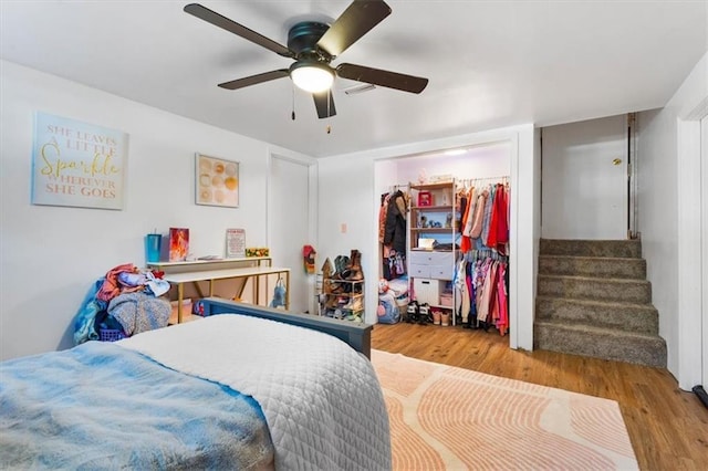 800 S Park Ave, Oak Grove, MO 64075 - bedroom featuring wood finished floors, ceiling fan, and a closet