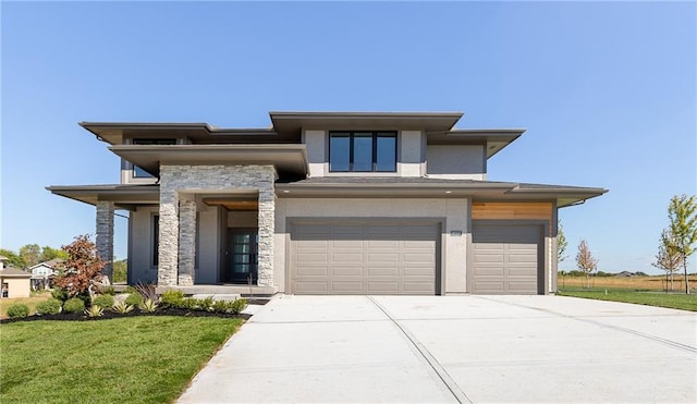 3509 W 187th St, Overland Park, KS 66085 - prairie-style house with an attached garage, concrete driveway, stone siding, a front yard, and stucco siding
