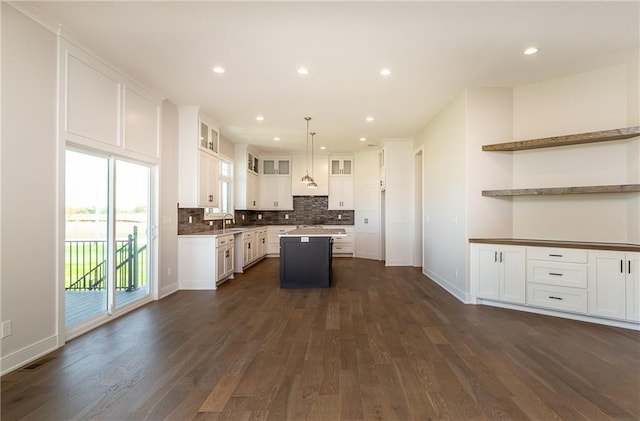 3509 W 187th St, Overland Park, KS 66085 - kitchen featuring open shelves, a center island, dark wood-type flooring, tasteful backsplash, and recessed lighting
