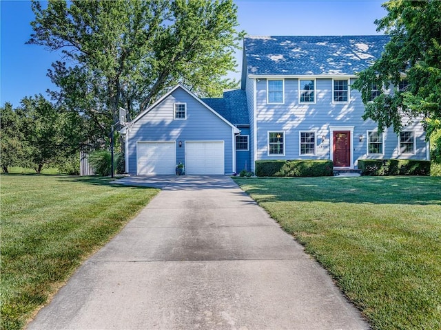 28804 E 116th St, Lees Summit, MO 64086 - colonial-style house featuring concrete driveway, a garage, and a front lawn