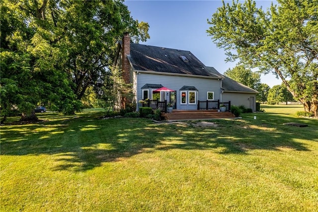 28804 E 116th St, Lees Summit, MO 64086 - back of property with a wooden deck, a chimney, and a yard