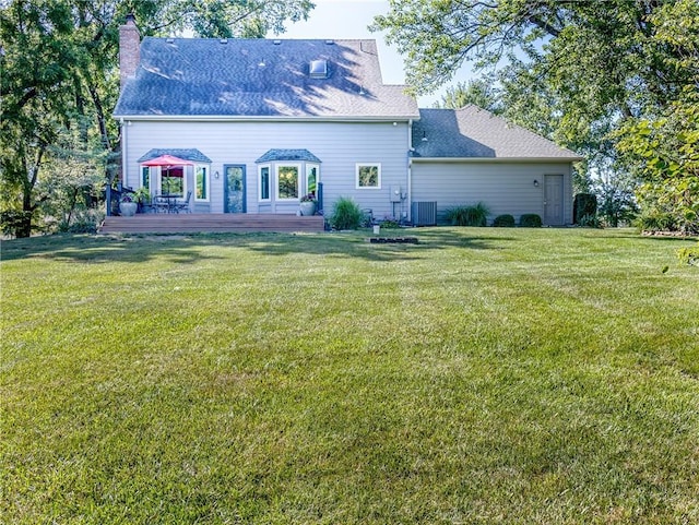 28804 E 116th St, Lees Summit, MO 64086 - rear view of property featuring a wooden deck, a chimney, a lawn, and roof with shingles