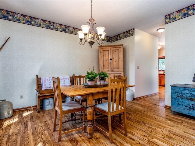 28804 E 116th St, Lees Summit, MO 64086 - dining area featuring light wood finished floors and a chandelier
