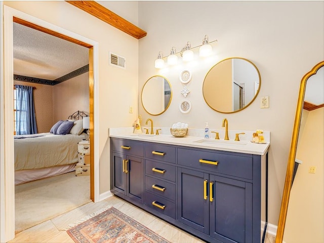 28804 E 116th St, Lees Summit, MO 64086 - full bathroom with double vanity, ensuite bathroom, and a textured ceiling