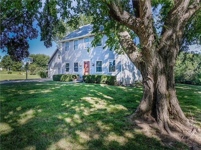 28804 E 116th St, Lees Summit, MO 64086 - colonial house featuring a front yard and an attached garage
