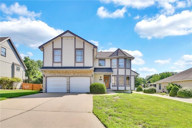 2431 S Ponca Ave, Independence, MO 64057 - view of front of home featuring driveway, an attached garage, and stone siding