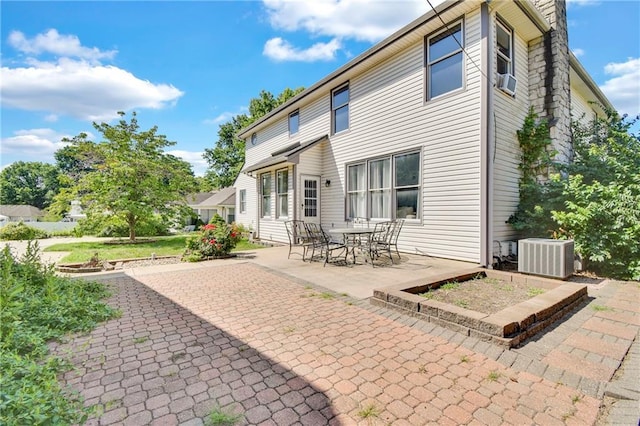 2431 S Ponca Ave, Independence, MO 64057 - back of house with a patio area
