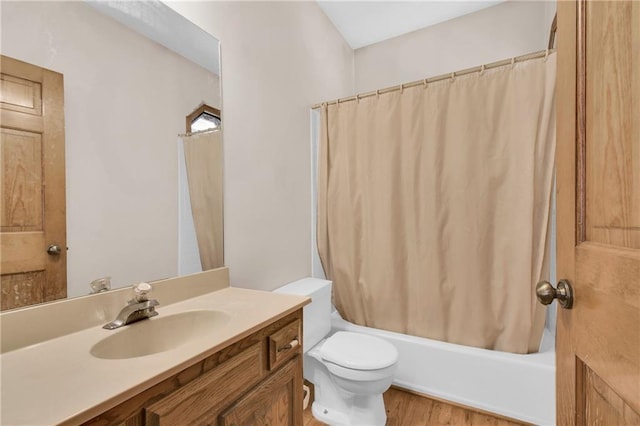 2431 S Ponca Ave, Independence, MO 64057 - bathroom with vanity, shower / bath combination with curtain, and wood finished floors