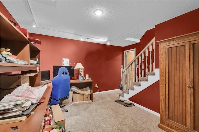 2431 S Ponca Ave, Independence, MO 64057 - carpeted home office with rail lighting and a textured ceiling